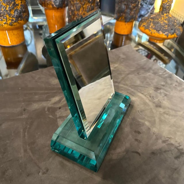 his mid-century modern vanity mirror attributed to Fontana Arte is dated to the 1950s. The mirror is crafted from thick,...