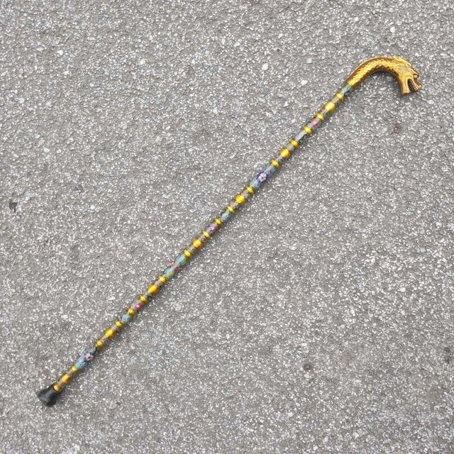 This is a striking vintage Chinese cloisonné enamel cane, featuring a gilt bronze dragon head handle and a slender,...