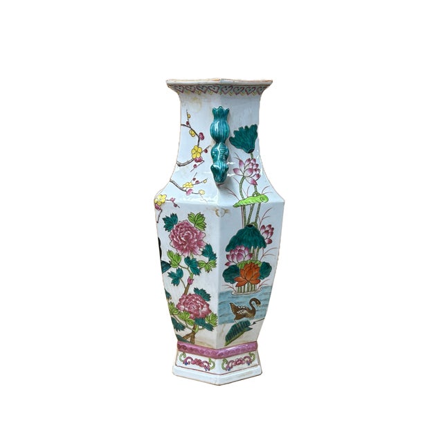 Elevate your decor with this stunning hexagonal porcelain vase, a true testament to intricate artistry and classic design....