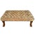 Large-scale upholstered ottoman coffee table made in the English Regency style and featuring deep diamond tufting across a...