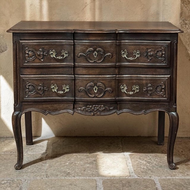 Charming Country French Louis XV styling gives this walnut commode a graceful, well-defined silhouette that immediately...