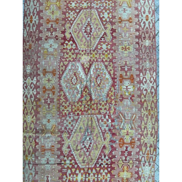 Beautiful mid-century Turkish Kilim featuring intricate geometrical designs and vibrant colors. This antique Anatolian...