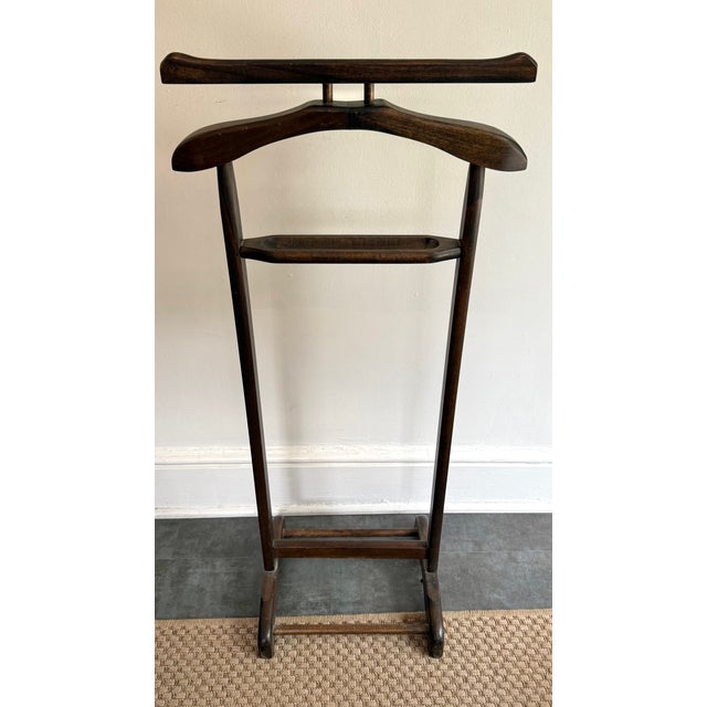 Vintage wooden valet butler stand made with a suit coat hanger and a change tray. Perfect for a bedroom or walk-in closet....