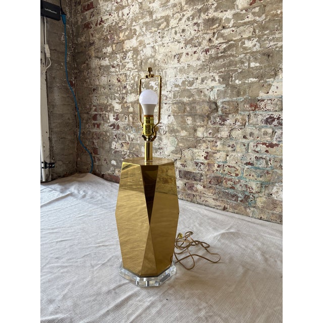 Add a bold, sophisticated statement to your space with this striking vintage table lamp. Featuring a tall, faceted brass...