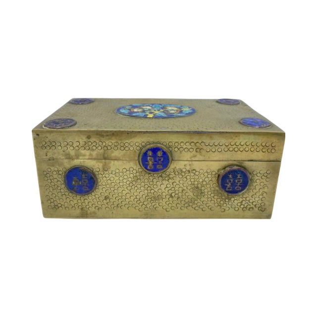 Details: -Chinese brass and enamel trinket box with an oval floral design on top with four circular symbols on the corners...