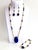 An elegant one-of-a-kind three-piece jewelry parure handcrafted with genuine Lapis Lazuli and luminous Mother of Pearl,...