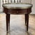 Antique French Louis XVI Mahogany Marble Top Bouillotte Table represents an understated elegance that is perfect for the...