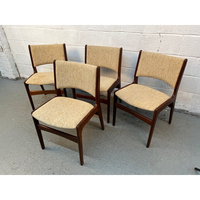 Exceptional set of four vintage Danish Modern Erik Buch "Model 89" dining chairs, an iconic mid-century design celebrated...