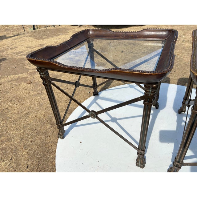 This pair of vintage Maitland Smith nail head leather and glass end side tables exudes Hollywood Regency style with a...