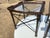 This pair of vintage Maitland Smith nail head leather and glass end side tables exudes Hollywood Regency style with a...