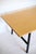 The Danish cabinetmaker dining table or desk features a light wood top and round black legs. The tabletop is crafted from...
