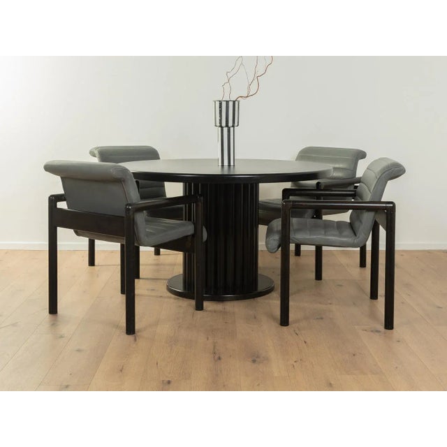 Postmodern dining chairs by Flötotto from the 1980s. Black lacquered solid wood frame. The seats and backrests with...