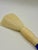 Sculptural oversized calligraphy brush featuring a richly mottled cobalt blue handle, warm ivory-tone accents, and soft...