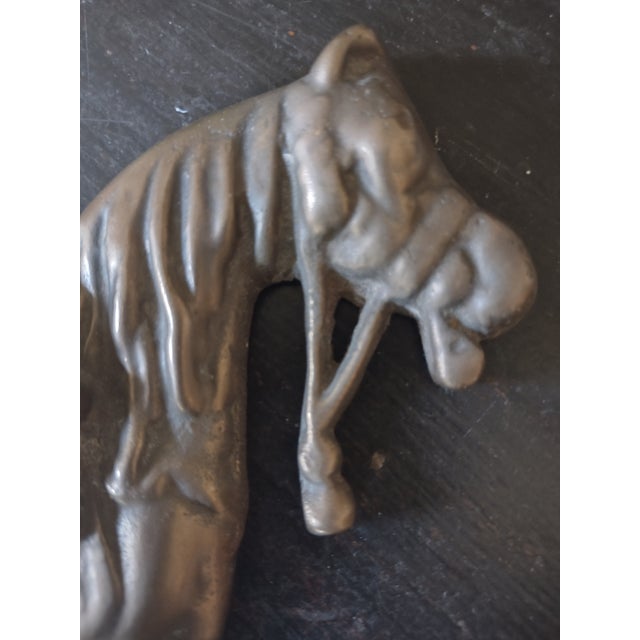 Offered is a vintage brass horse wall plaque. It is tarnished but could be polished. It measures 8" long by 6" tall and...