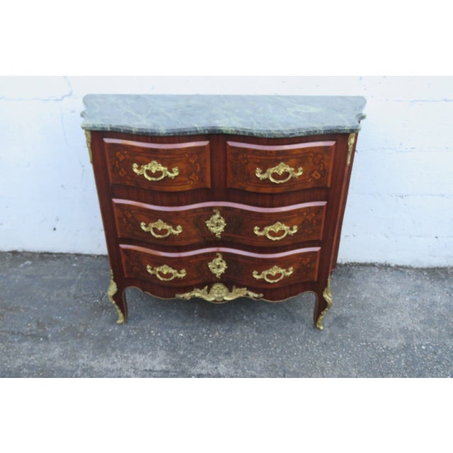 This classic Dresser is made out of wood, solid wood, veneer, metal, and marble. This Commode was made in the lovely...