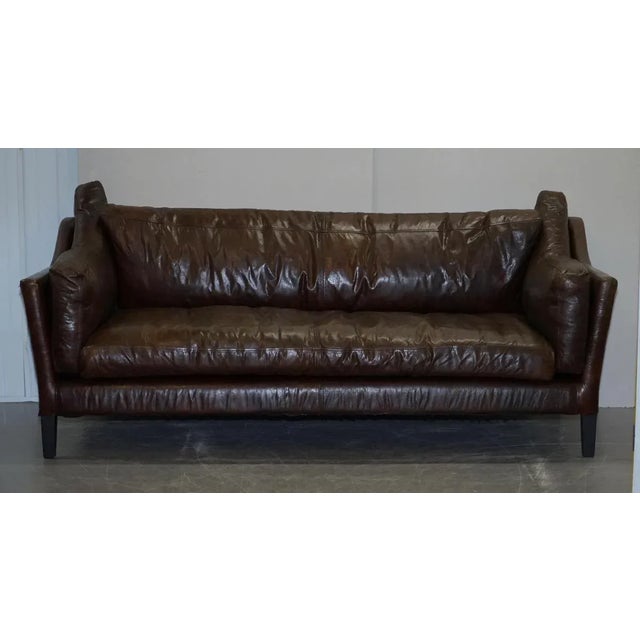 Very comfortable had dyed brown leather designer styled three seat sofa A very good looking decorative and comfortable...
