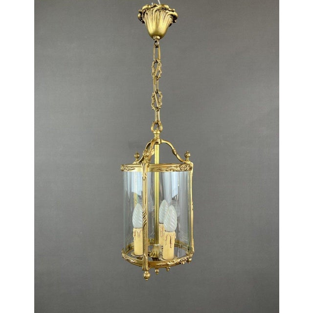 Refined pendant light, embodying the elegance and grace of the Louis XVI style. Crafted from finely worked bronze, this...