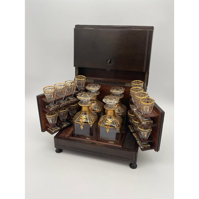 French Napoleon III period cave a liqueur box. Box with brass inlay and bun feet, The hinged sides and top fold in to...