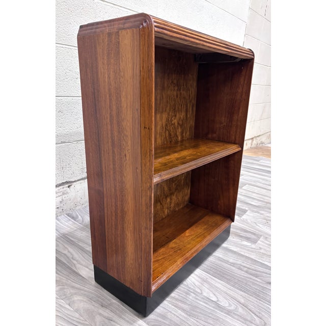 This is a gorgeous vintage Art Deco waterfall-style oak bookcase featuring distinctive rounded waterfall edges, stepped...