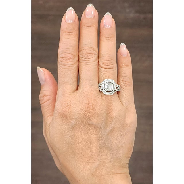 A striking diamond ring featuring approximately 2.15-carat mixed-cut white diamond, set in 18k white gold. The diamonds...