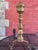 This is an impressive pair of antique brass and iron fireplace andirons featuring tall, elaborately turned baluster-form...
