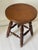 American folk art round table or piano stool 14” in diameter, on 4 spindle legs.