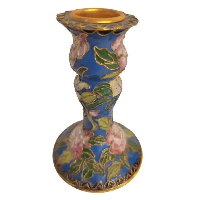 A sweet pair of small Cloisonne metal blue brass inlaid candle stick holders. The holders are not a match, one is navy...