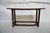 Wood and Twig Console Table The top surface of the table has narrow twig pieces (almost looks like bamboo) tightly bound...