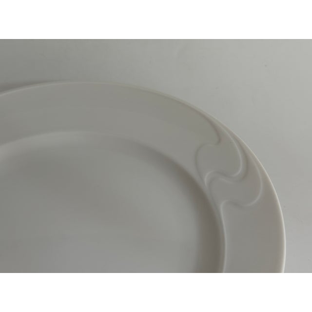 Item: Breakfast plate 20,5 cm Manufacturer: Rosenthal Series: Asimmetria Decoration: White Material: Porcelain Condition:...