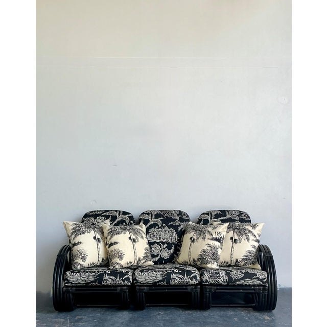 This exceptional vintage rattan sofa combines sophisticated craftsmanship with a distinctly tropical sensibility,...