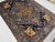 Bring rich color and bold pattern to your space with this blue Afghan Sultani wool area rug, made with natural dyes and a...