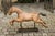 A vintage Folk Art painted iron old child riding horse from the mid-20th century mounted on a new custom base. Born in the...