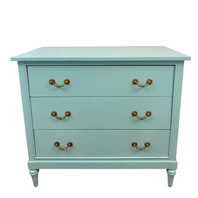 This 3-drawer chest has been freshly lacquered in Benjamin Moore Waterfall Blue. The handles offer a great accent in gold....