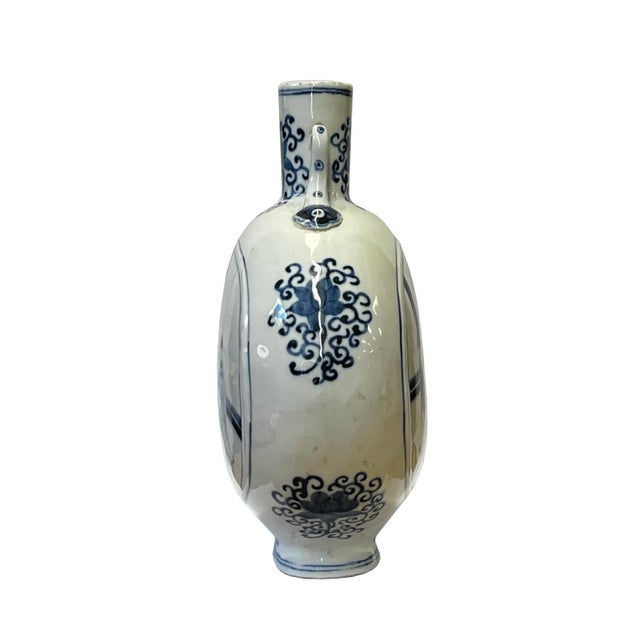 This is a Chinese decorative porcelain vase in a Blue and White color finish. The theme is an oriental people scenery...