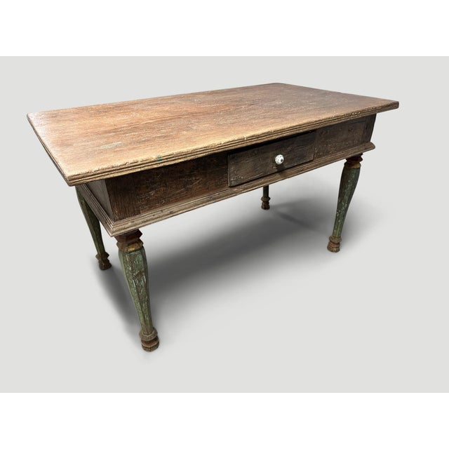 Antique colonial desk or console. The patina on this teak wood is beautiful. Hand carved legs with the original remnants...