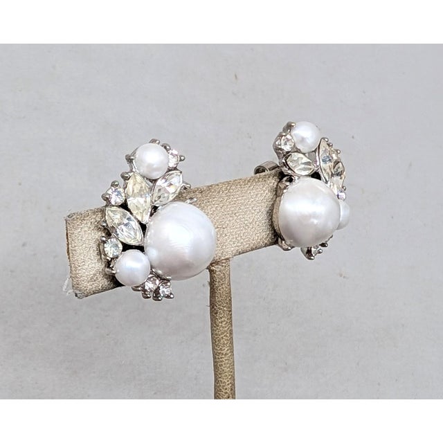 Late 1950s rhodium plated large mabe pearl with two smaller mabe pearls with clear marquise and round rhinestone earrings....