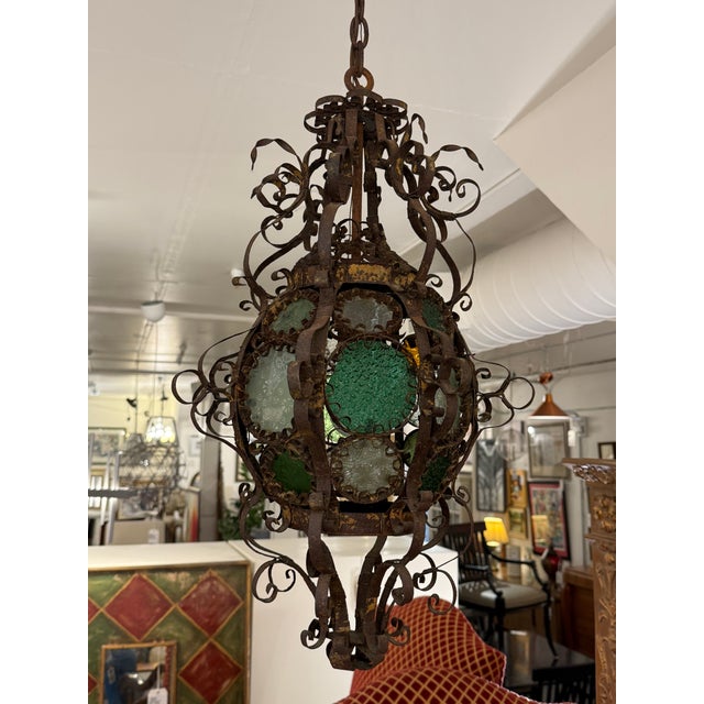 Design Plus Gallery presents an Antique Venetian Stained Glass Lantern from the 19th Century. This ornate hanging lantern...