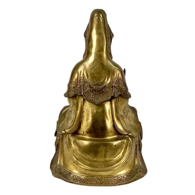 Chinese Gilt Guan Yin Buddha Bronze Sculpture. This piece features delicate facial features, serene expression, and...