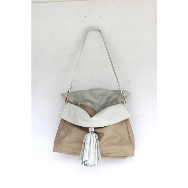 Stylish Beige Leather with Large Oyster White Leather Tassel and leather fold over front and back flaps Slouch Shoulder...