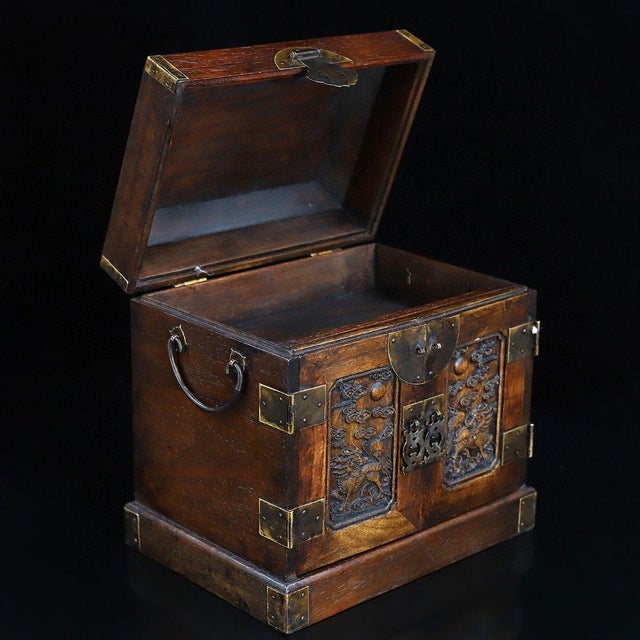This impressive Chinese chest, known as a "Guan Xiang" (Official's Box), is a stunning example of traditional Asian...