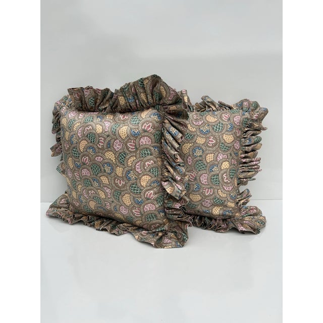 Pair of large, handmade ruffle edge pillows. Silk like, smooth material featuring circular, overlapping medallions...