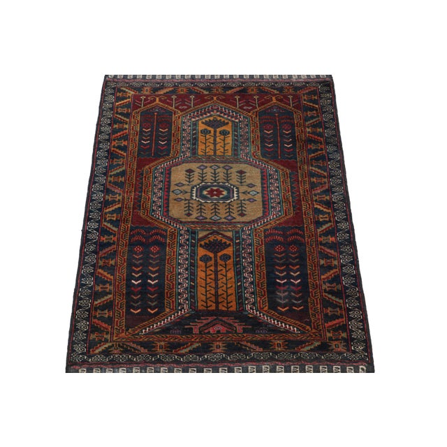 Hand knotted in wool, this 3x4 Baluch rug represents a new line of tribal carpets in the Modern Classics Collection by Rug...