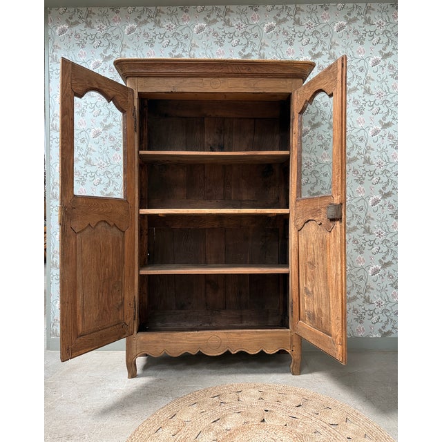 Rare, this solid oak norman display cabinet combines the generous proportions of a traditional 18th-century wardrobe with...