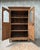 Rare, this solid oak norman display cabinet combines the generous proportions of a traditional 18th-century wardrobe with...