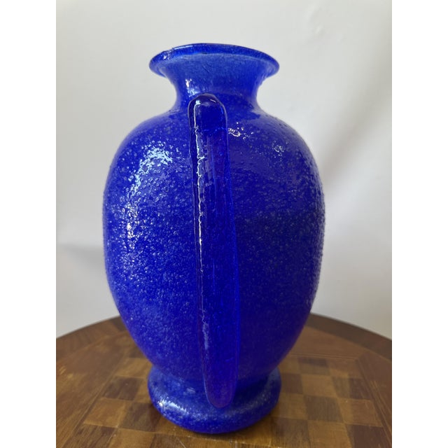 Artistic Murano glass vase with two large, hot-applied side handles, designed by the renowned sculptor, architect, and...