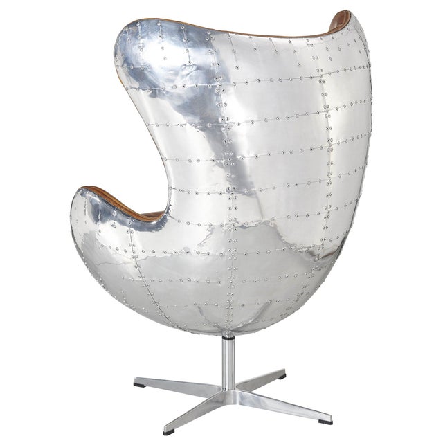 "The Cruz Egg Chair has all the aviator glam of the 1950's. This classic design has a rustic brown leather with stitching...