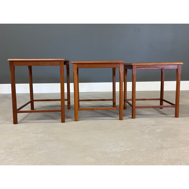 A set of 3 mid century modern nesting tables. Made in Denmark. Excellent condition. Circa 1960’s. Tile insert. Signed....