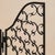 A 20th century French wrought iron table mirror. The central arched plate is framed in blackened iron and flanked by...