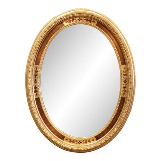 Mid-20th Century French Oval Giltwood Mirror With Floral Motifs For Sale