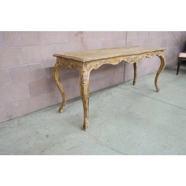 Country French console with cabriole legs, carved accents and distressed finish.